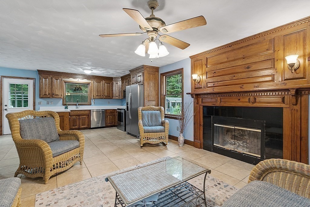 102 B Lunenburg Road Townsend, MA 01474 - Photo 8 of 41 a living room with furniture and a fireplace
