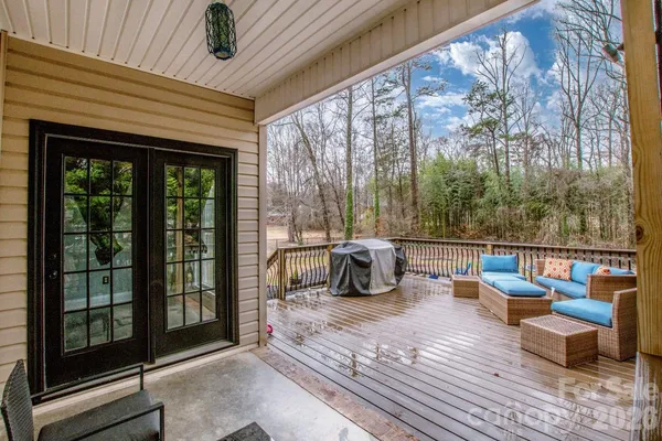 a view of roof deck with patio
