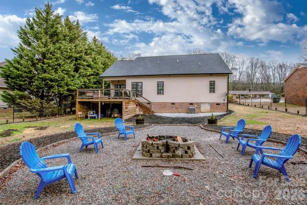a view of a house with backyard porch and sitting area