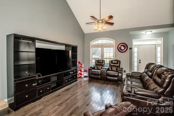 a living room with furniture and a flat screen tv
