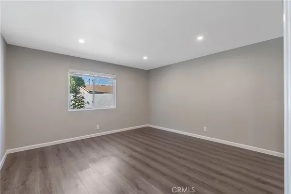 a view of room with wooden floor and window