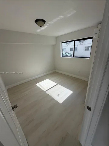 view of an empty room with a window