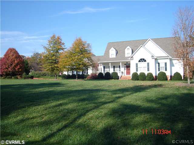 1826 Rabbit Warren Road Manakin-Sabot, VA 23103 - Photo 1 of 12 a front view of a house with a yard