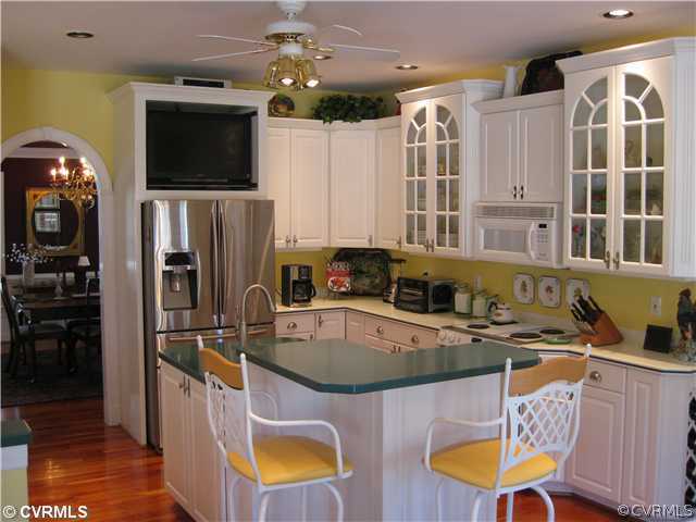 1826 Rabbit Warren Road Manakin-Sabot, VA 23103 - Photo 7 of 12 a kitchen with stainless steel appliances a stove a sink and a refrigerator