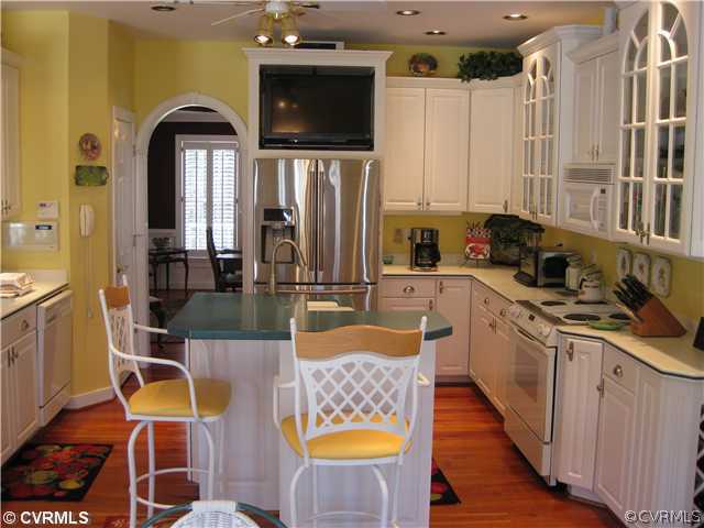 1826 Rabbit Warren Road Manakin-Sabot, VA 23103 - Photo 8 of 12 a kitchen with stainless steel appliances granite countertop a sink and a refrigerator