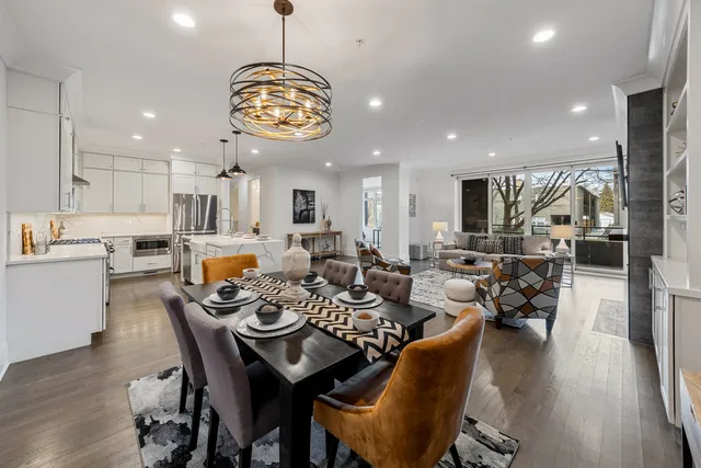 a view of a room with a table and chairs