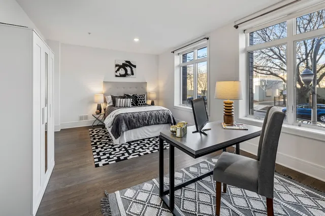 a bedroom with a bed and a table in it