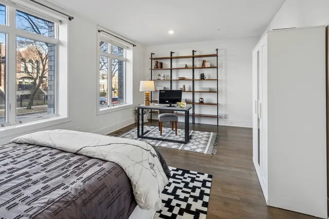 a large bathroom with a double vanity sink a large mirror a shower and a