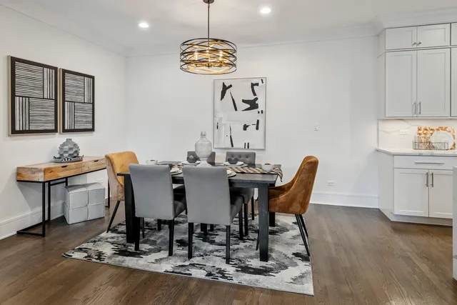 a kitchen with stainless steel appliances a sink a stove a refrigerator and cabinets