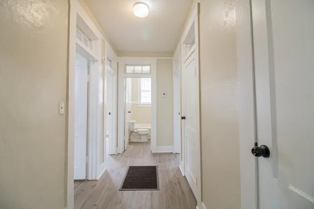 a view of a bathroom with a sink and a mirror