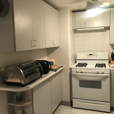 166 Pasco Road Springfield, MA 01151 - Photo 8 of 22 a kitchen with a stove and a refrigerator