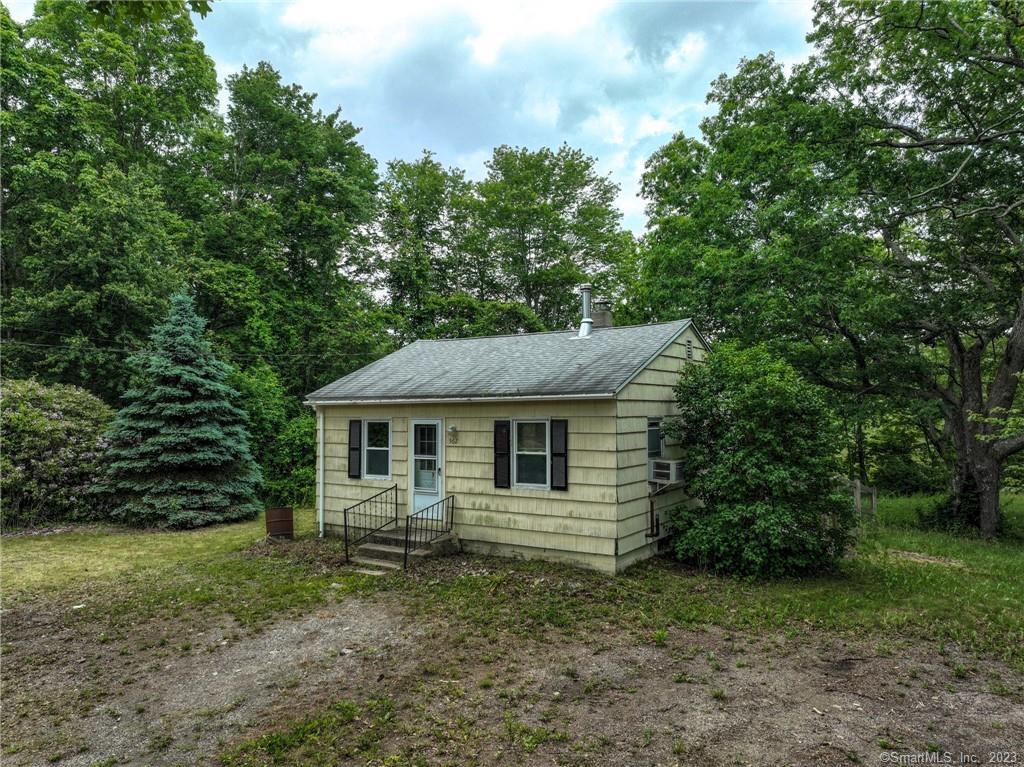 562 Lantern Hill Road Ledyard, CT 06339 - Photo 1 of 1 a front view of a house with a garden