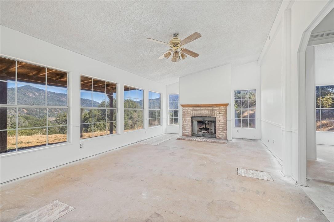 4966 Watt Road Ahwahnee, CA 93601 - Photo 19 of 56 Den with fireplace. Photo taken before the new carpet was installed.