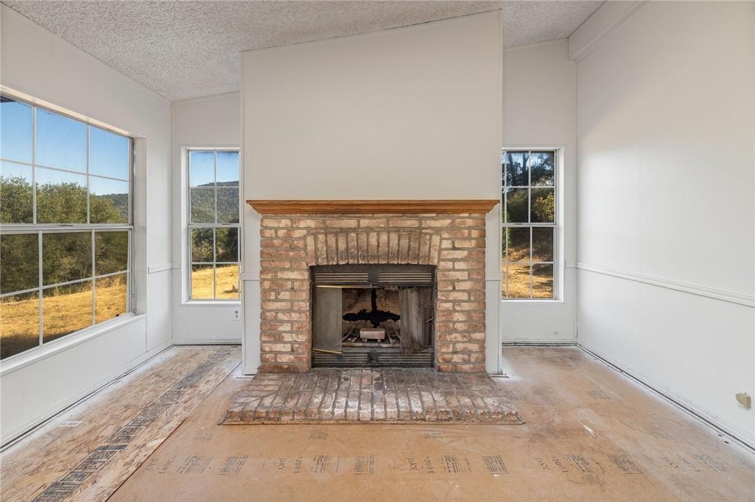4966 Watt Road Ahwahnee, CA 93601 - Photo 20 of 56 Fireplace. Photo taken before the new carpet was installed.