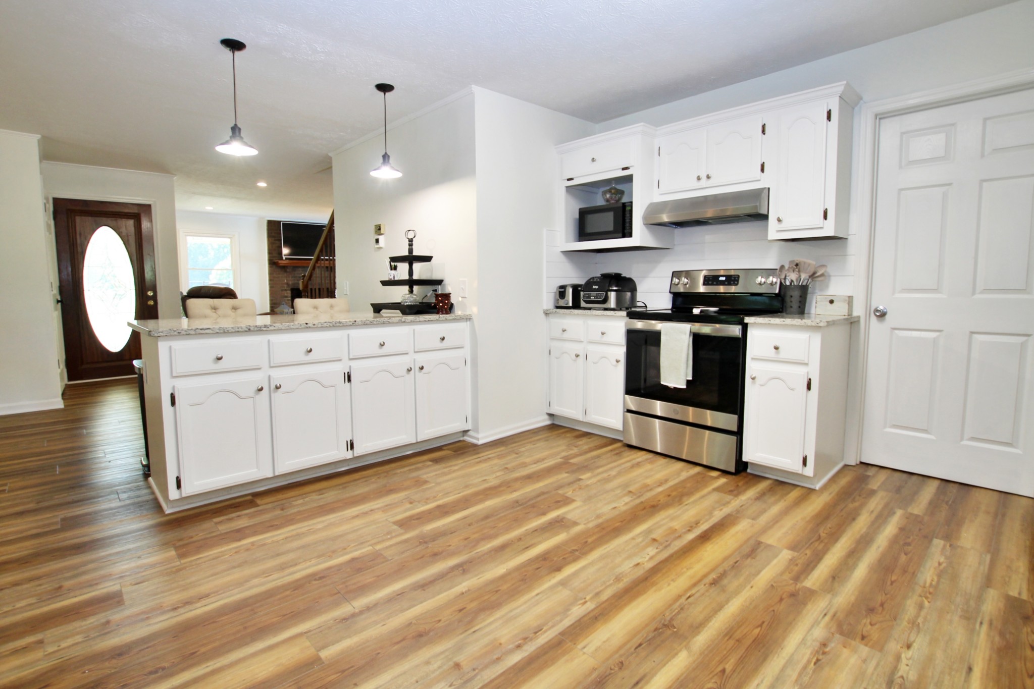 101 Timberlake Drive Springfield, TN 37172 - Photo 11 of 38 a kitchen with stainless steel appliances granite countertop a stove a sink and a refrigerator