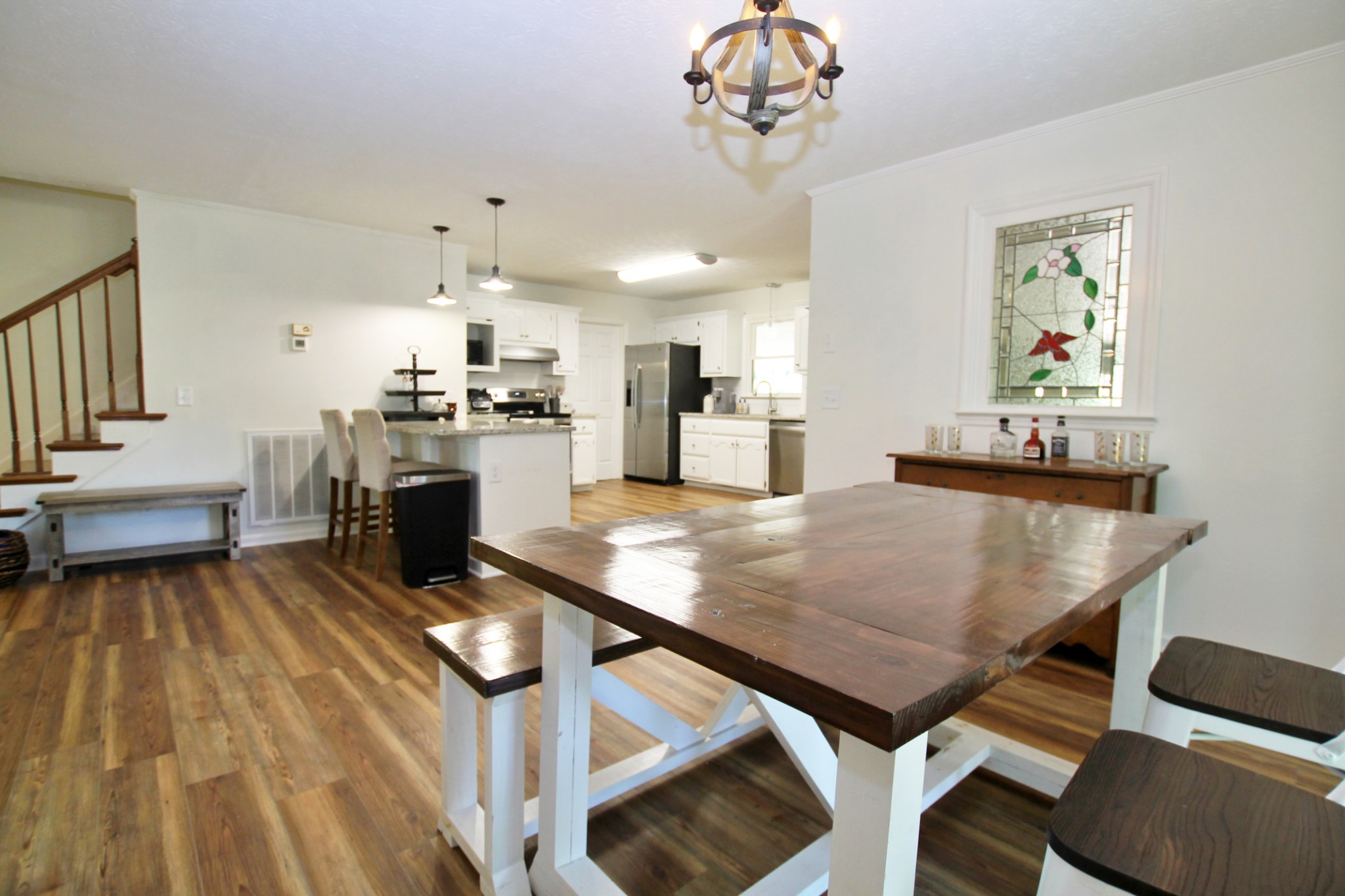 101 Timberlake Drive Springfield, TN 37172 - Photo 13 of 38 a dining room with kitchen island a table and chairs