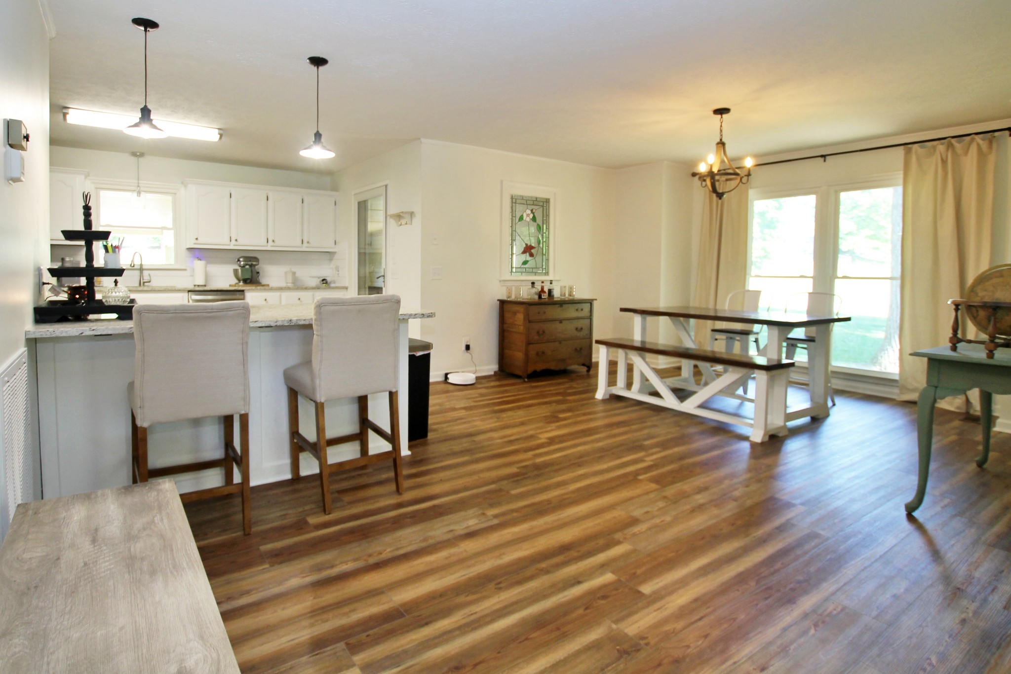 101 Timberlake Drive Springfield, TN 37172 - Photo 14 of 38 a view of a kitchen with dining table chairs refrigerator and window