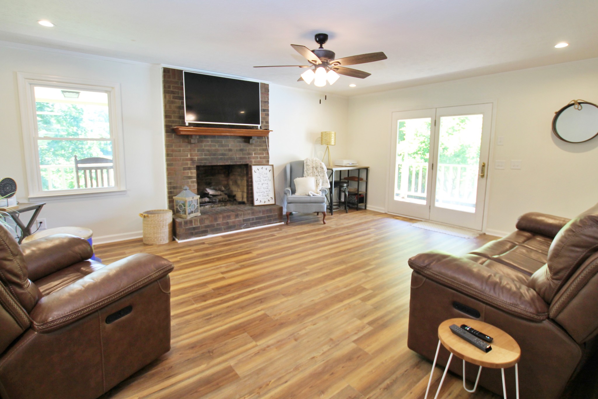 101 Timberlake Drive Springfield, TN 37172 - Photo 16 of 38 a living room with furniture a flat screen tv and a fireplace