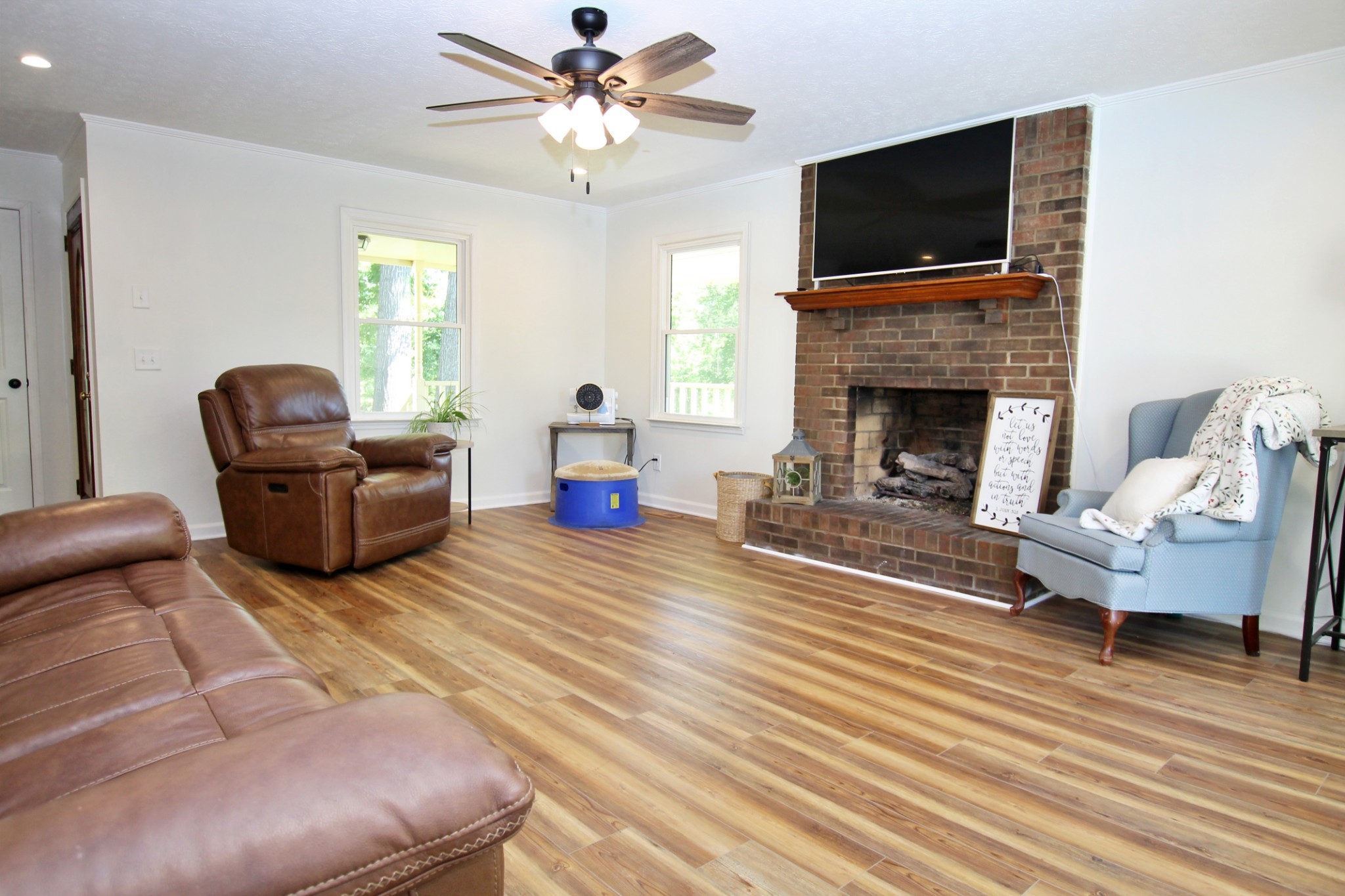 101 Timberlake Drive Springfield, TN 37172 - Photo 18 of 38 a living room with furniture a flat screen tv and a fireplace