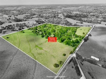 an aerial view of a residential houses with outdoor space