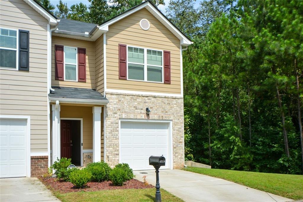 4014 Bryce Manor Lane Decatur, GA 30034 - Photo 1 of 1 a front view of a house with garden