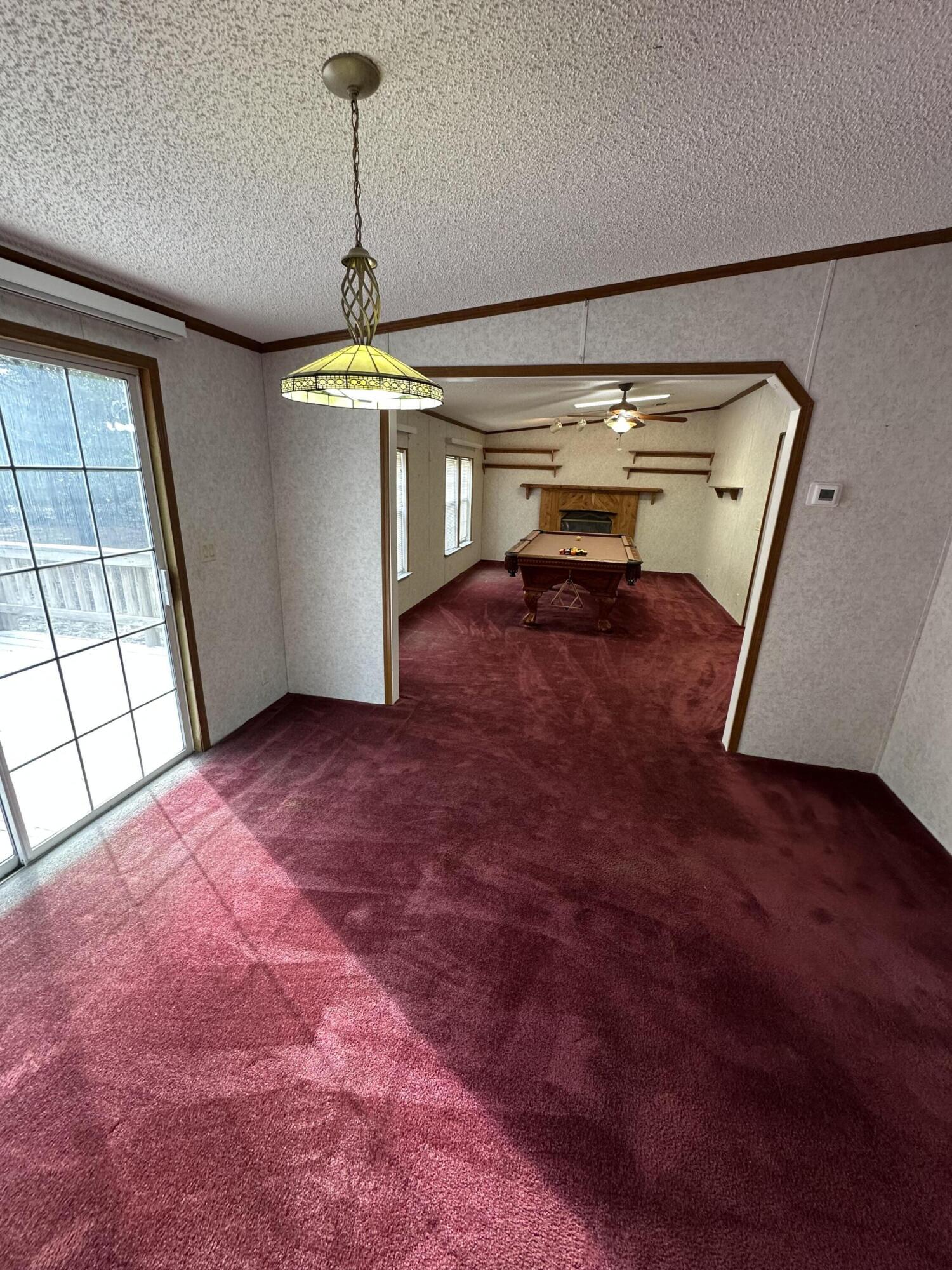 618 Oakridge Road DeFuniak Springs, FL 32433 - Photo 24 of 46 a view of a hallway with a chandelier