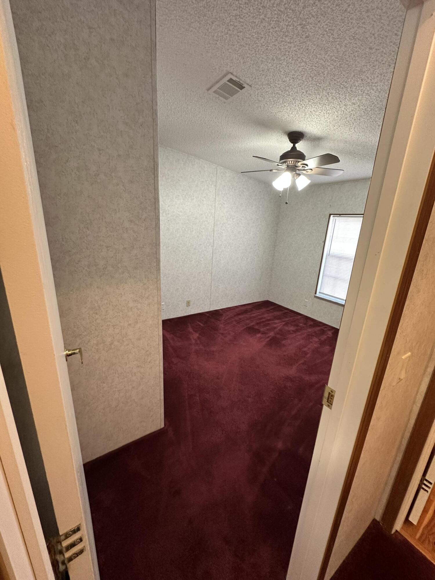 618 Oakridge Road DeFuniak Springs, FL 32433 - Photo 28 of 46 wooden floor in an empty room with a window
