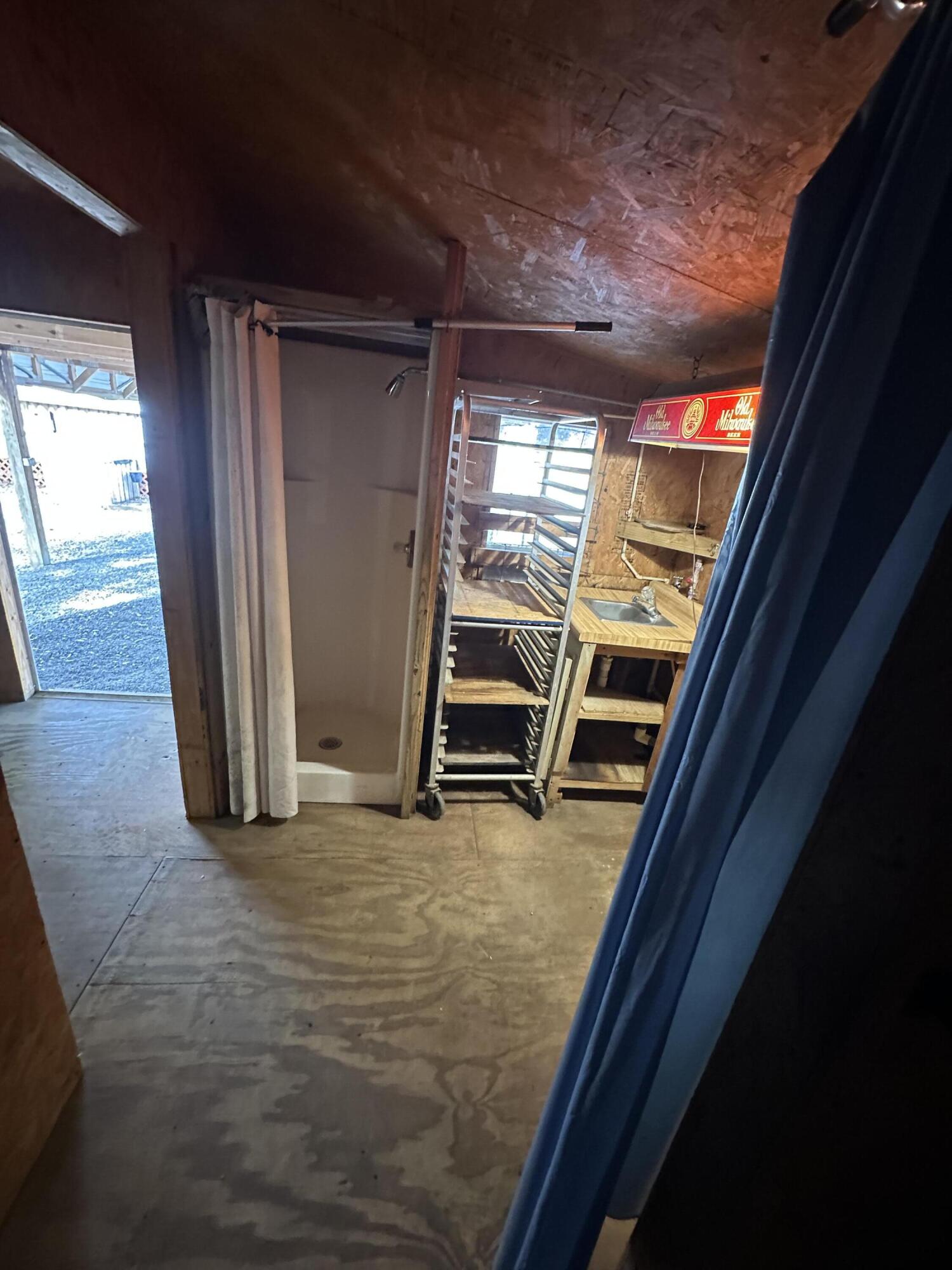 618 Oakridge Road DeFuniak Springs, FL 32433 - Photo 41 of 46 a view of a room with wooden floor and windows