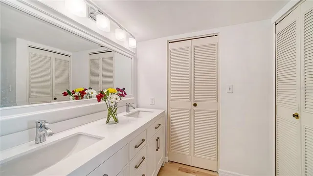 a bedroom with two beds and a window