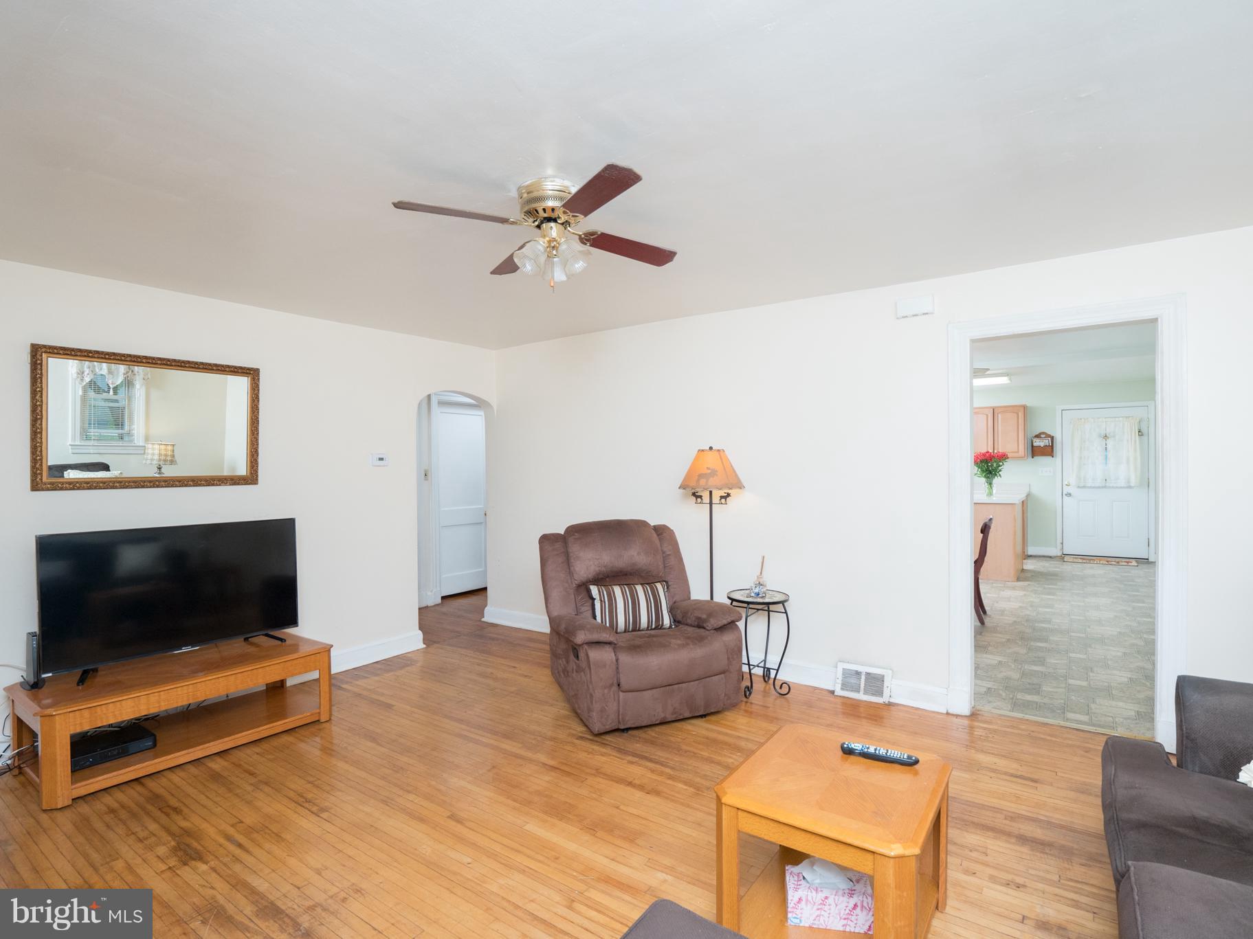 9431 Guilford Road Columbia, MD 21046 - Photo 12 of 28 a living room with furniture and a flat screen tv