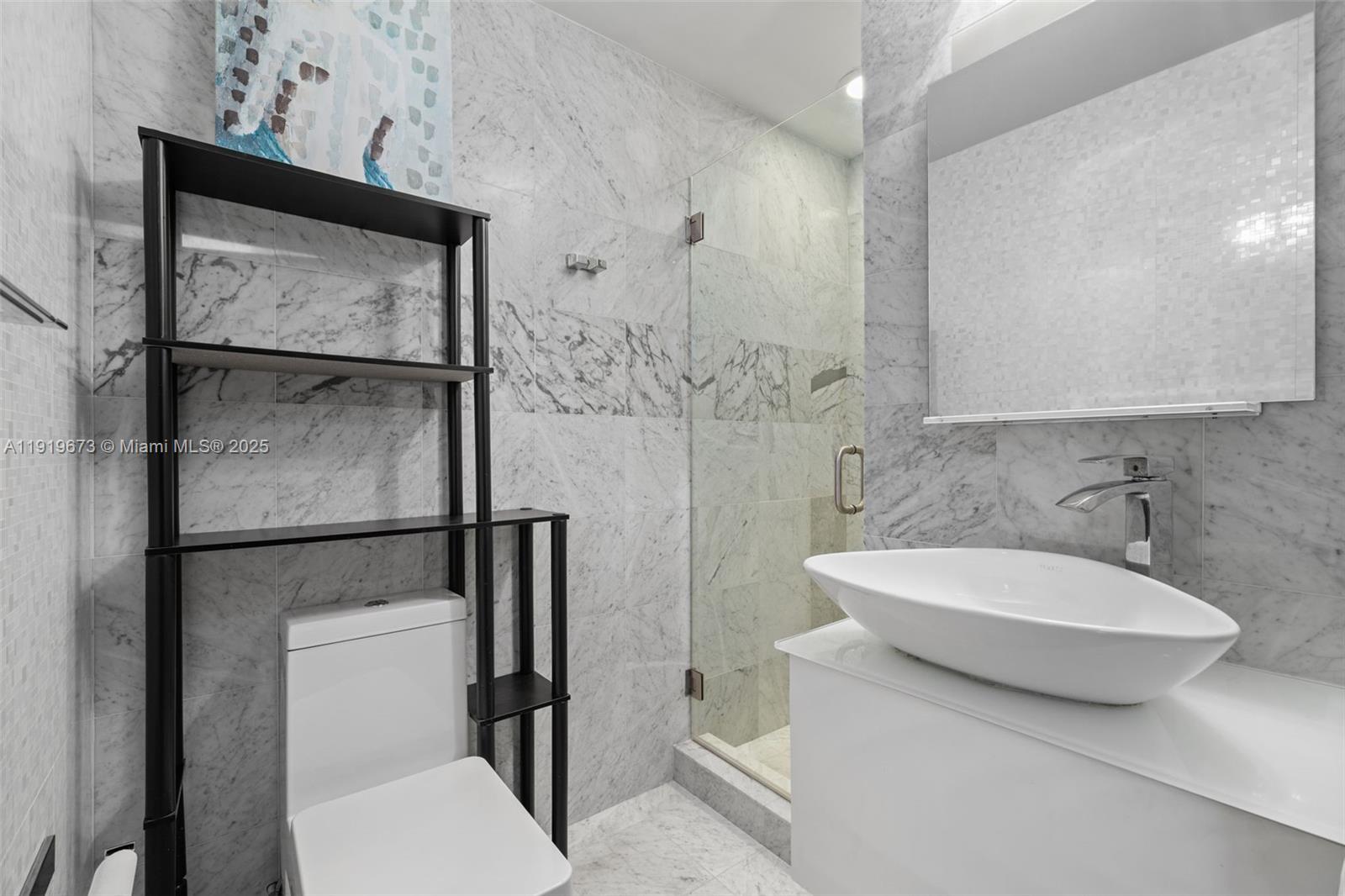 60 Southwest 13th Street, Unit 4606 Miami, FL 33130 - Photo 15 of 28 a bathroom with a toilet sink and shower