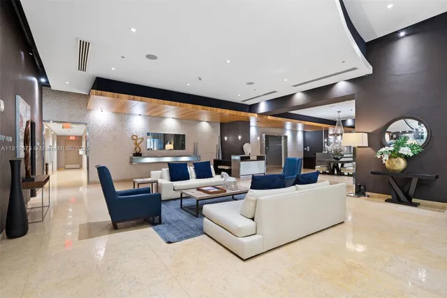 a living room with furniture and a large mirror