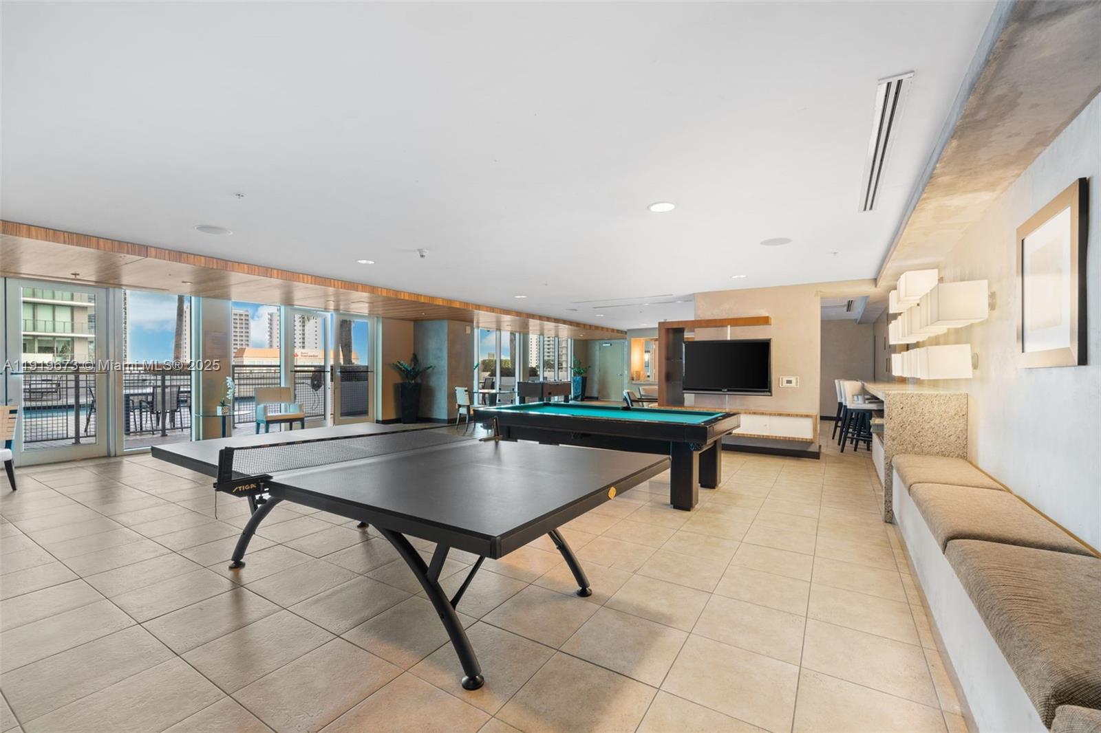 60 Southwest 13th Street, Unit 4606 Miami, FL 33130 - Photo 22 of 28 a living room with furniture and a table