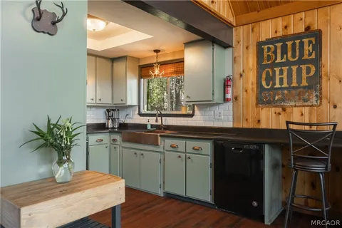a kitchen with a table and chairs in it