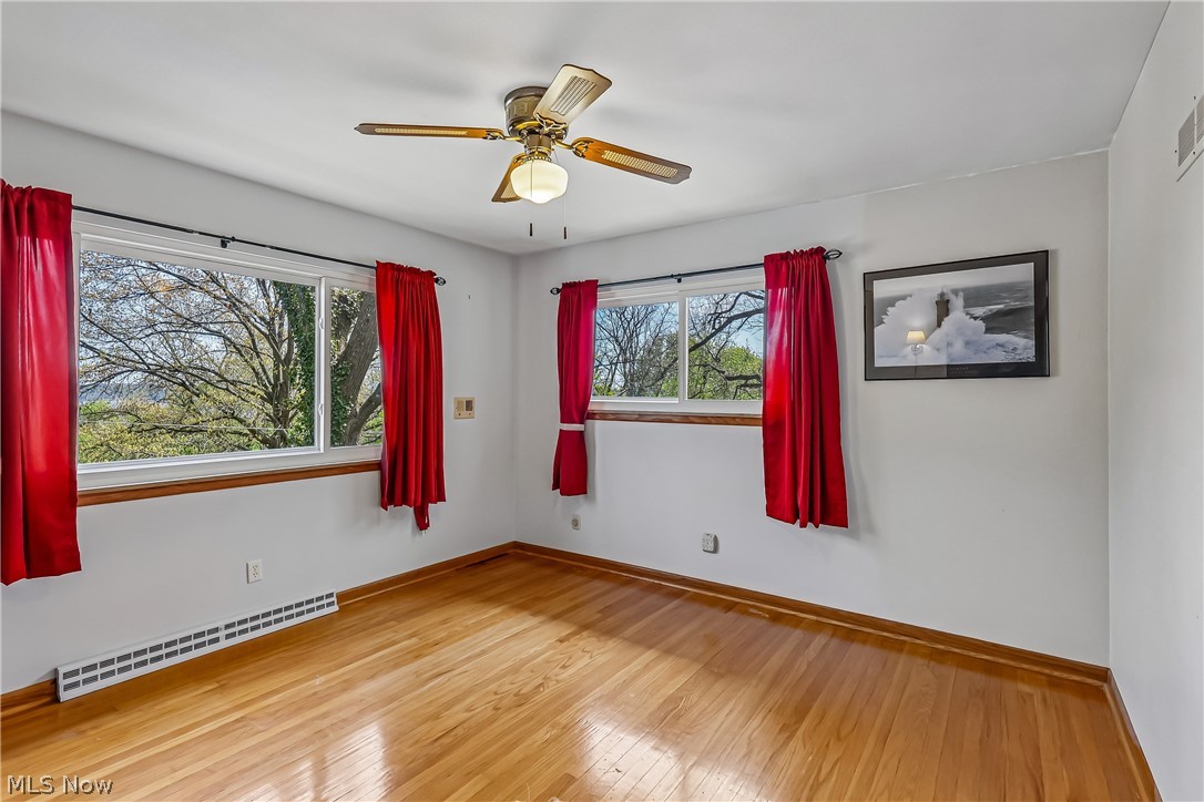 2060 6th Street Southwest Akron, OH 44314 - Photo 23 of 46 Bedroom featuring ceiling fan / light, wood flooring and plenty of natural light