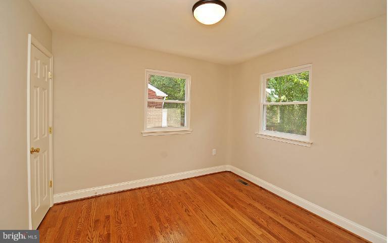 716 West Glebe Road Alexandria, VA 22305 - Photo 23 of 27 a view of a room with wooden floor and windows