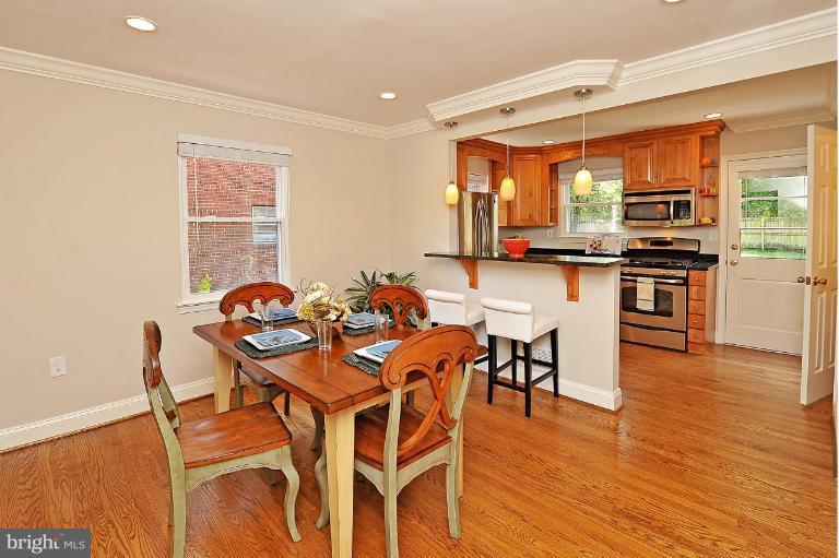 716 West Glebe Road Alexandria, VA 22305 - Photo 3 of 27 a view of a dining room with furniture and wooden floor