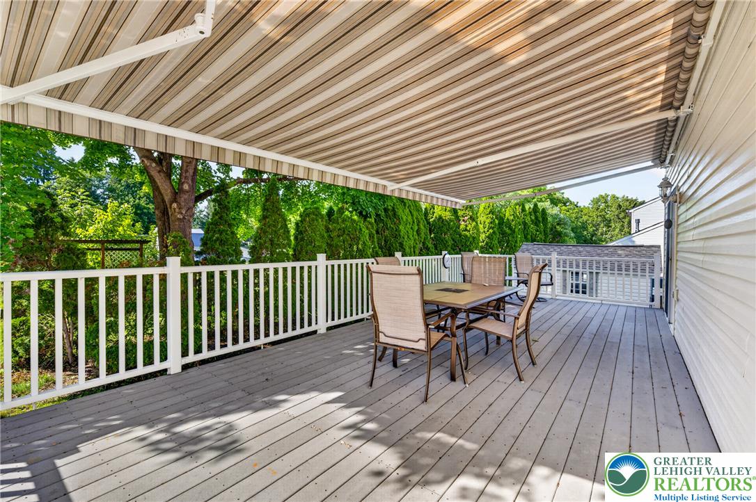 1702 Red Bud Road Quakertown, PA 18951 - Photo 59 of 68 Relax al fresco on this spacious outdoor deck, complete with an awning for comfortable shade.
