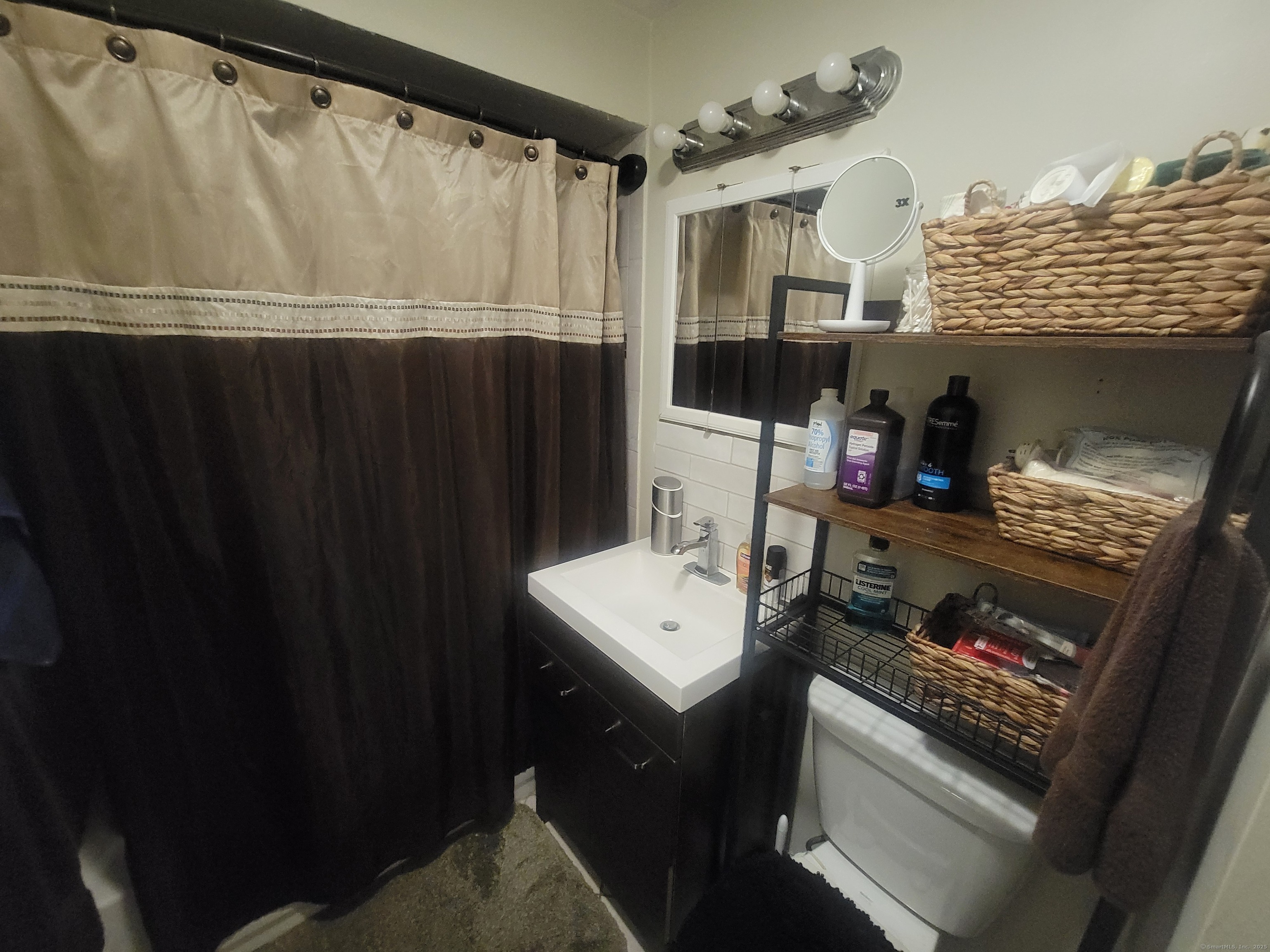 336 Circular Avenue Hamden, CT 06514 - Photo 12 of 21 a close view of a sink a washer and dryer