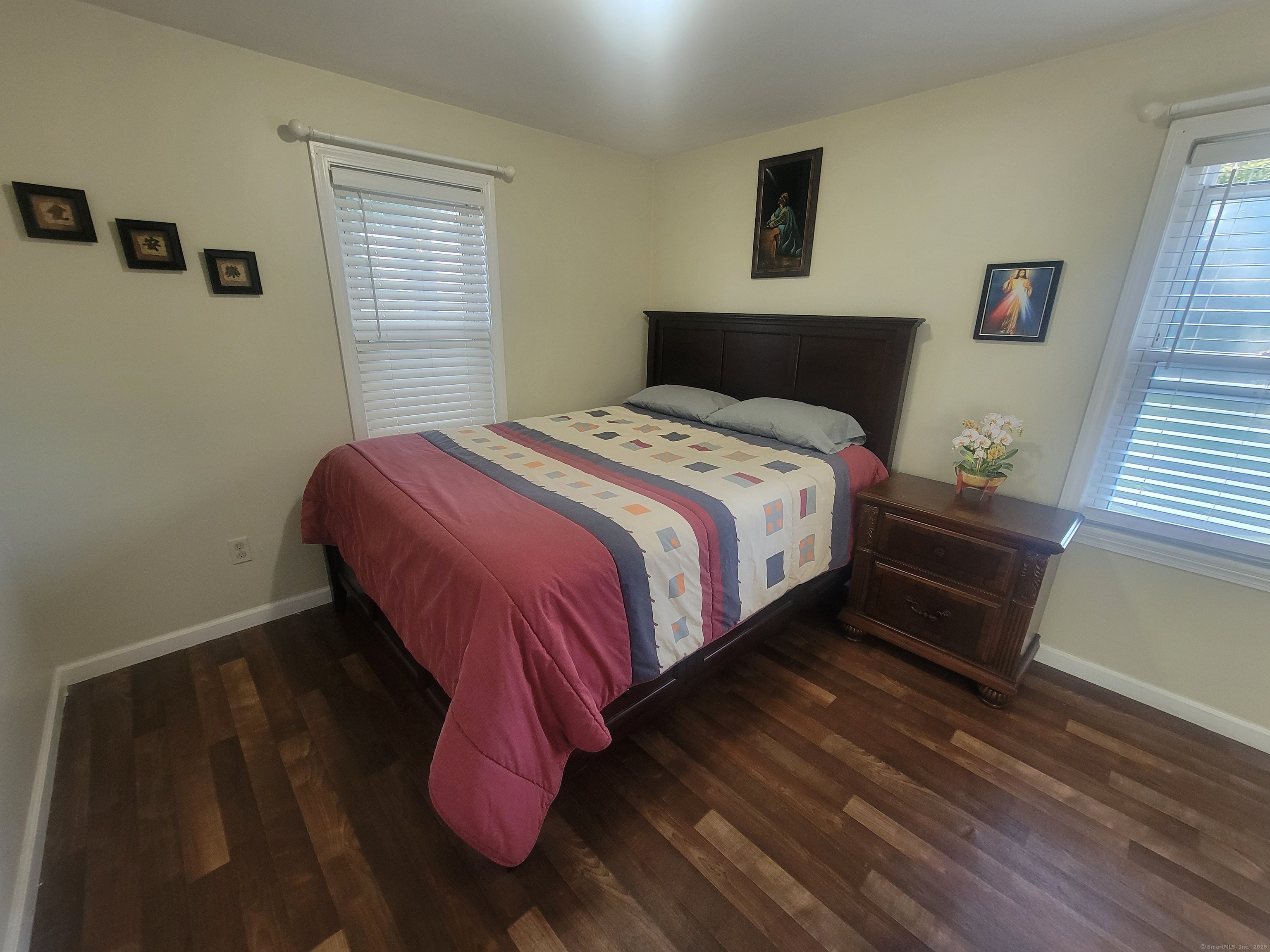 336 Circular Avenue Hamden, CT 06514 - Photo 14 of 21 a bedroom with a bed and wooden floor