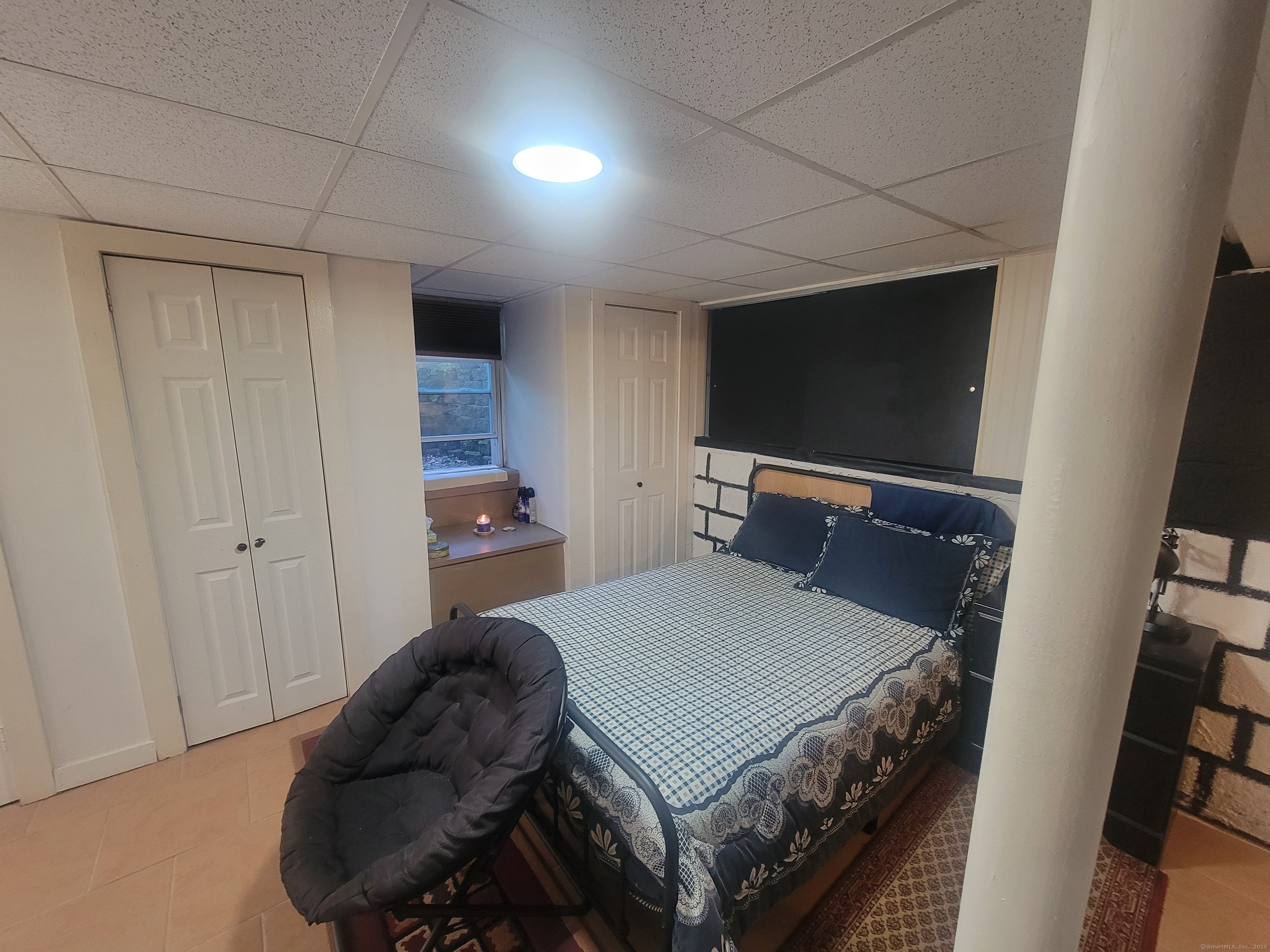 336 Circular Avenue Hamden, CT 06514 - Photo 15 of 21 a bedroom with a bed and a flat screen tv