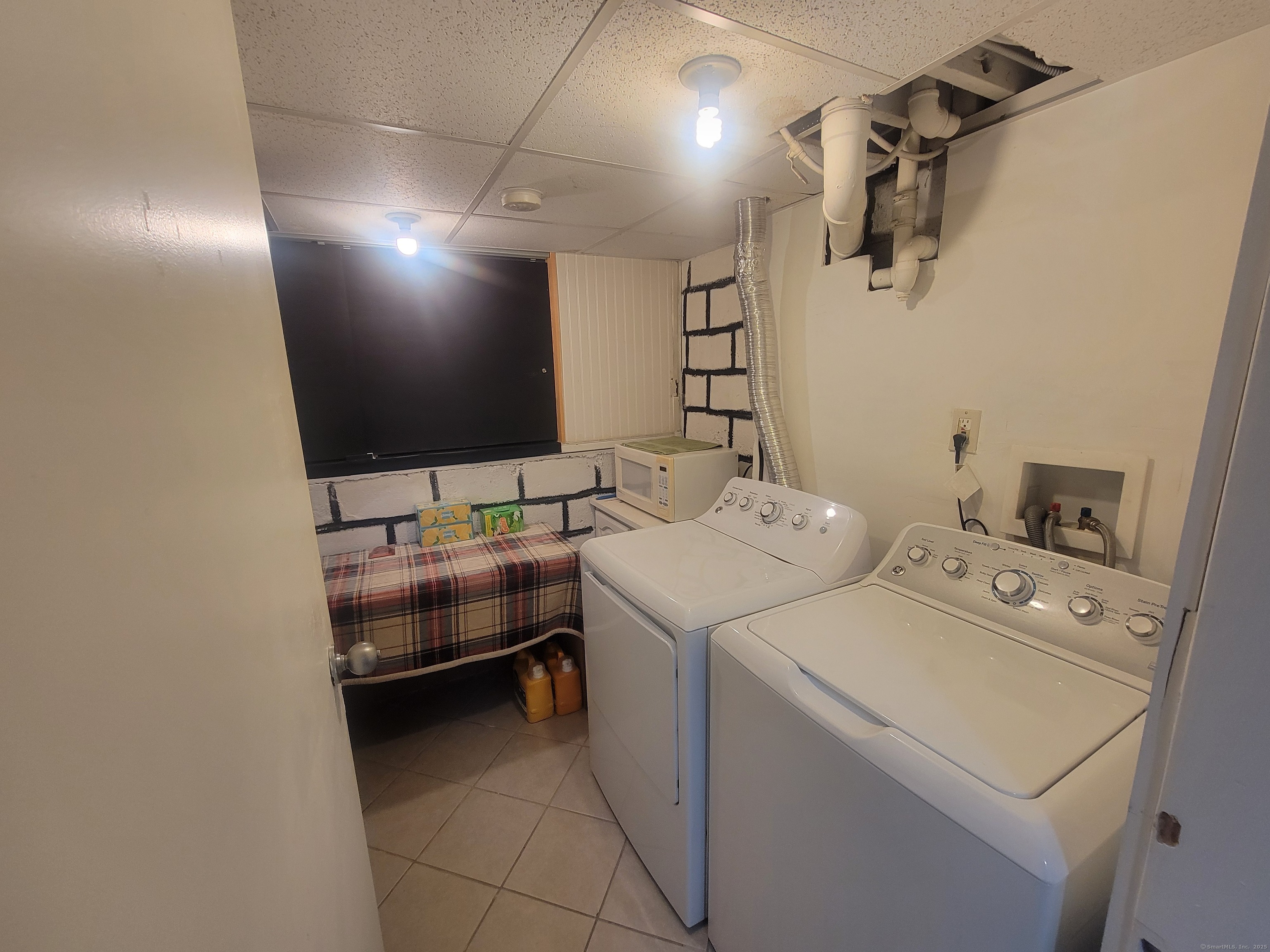 336 Circular Avenue Hamden, CT 06514 - Photo 19 of 21 a utility room with dryer and washer