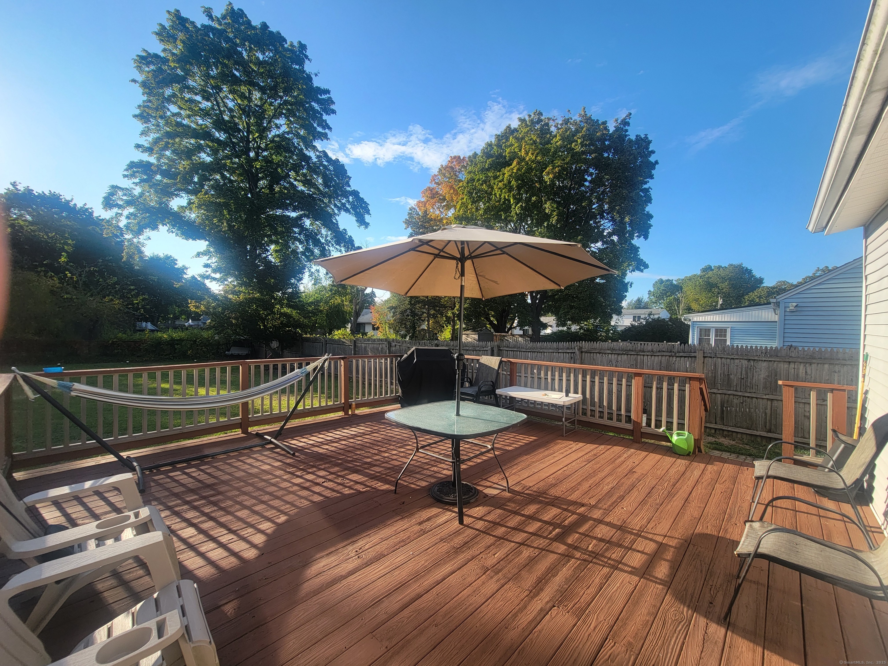336 Circular Avenue Hamden, CT 06514 - Photo 20 of 21 a view of a roof deck with chair and wooden floor