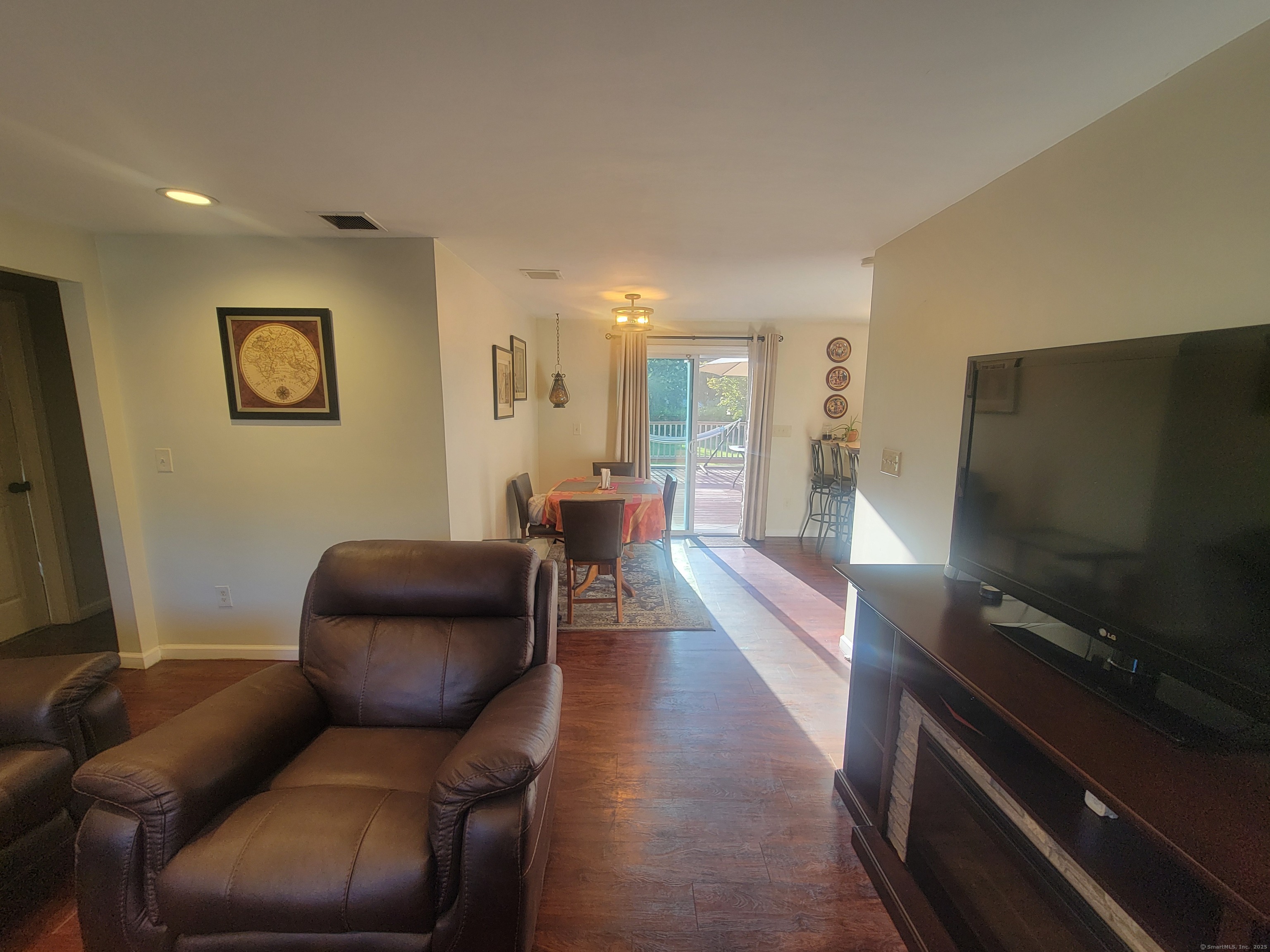 336 Circular Avenue Hamden, CT 06514 - Photo 4 of 21 a living room with furniture and a flat screen tv