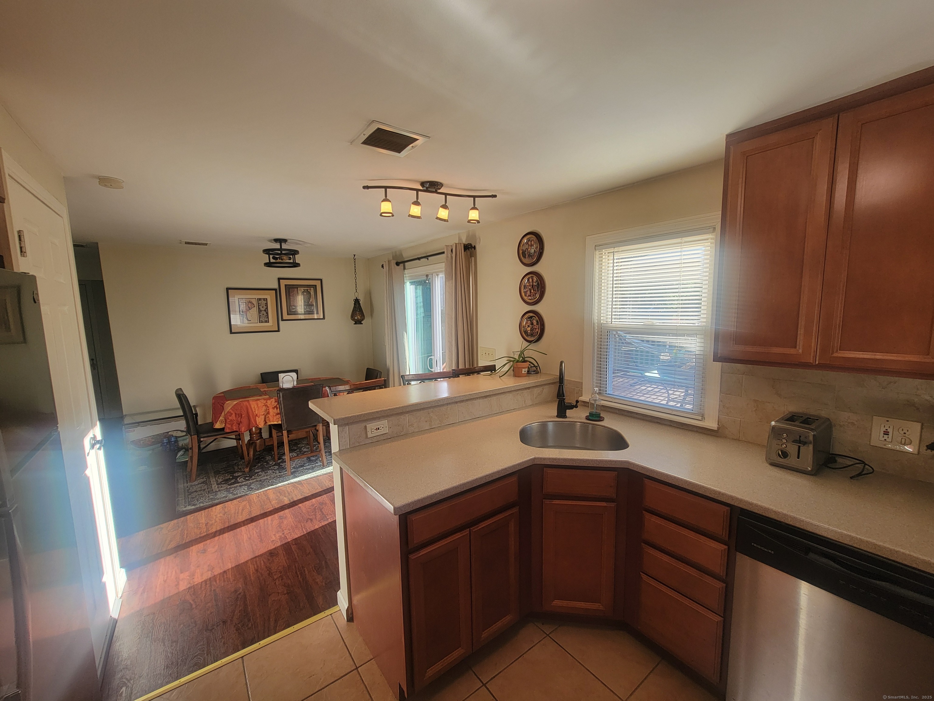 336 Circular Avenue Hamden, CT 06514 - Photo 8 of 21 a kitchen with a sink and cabinets