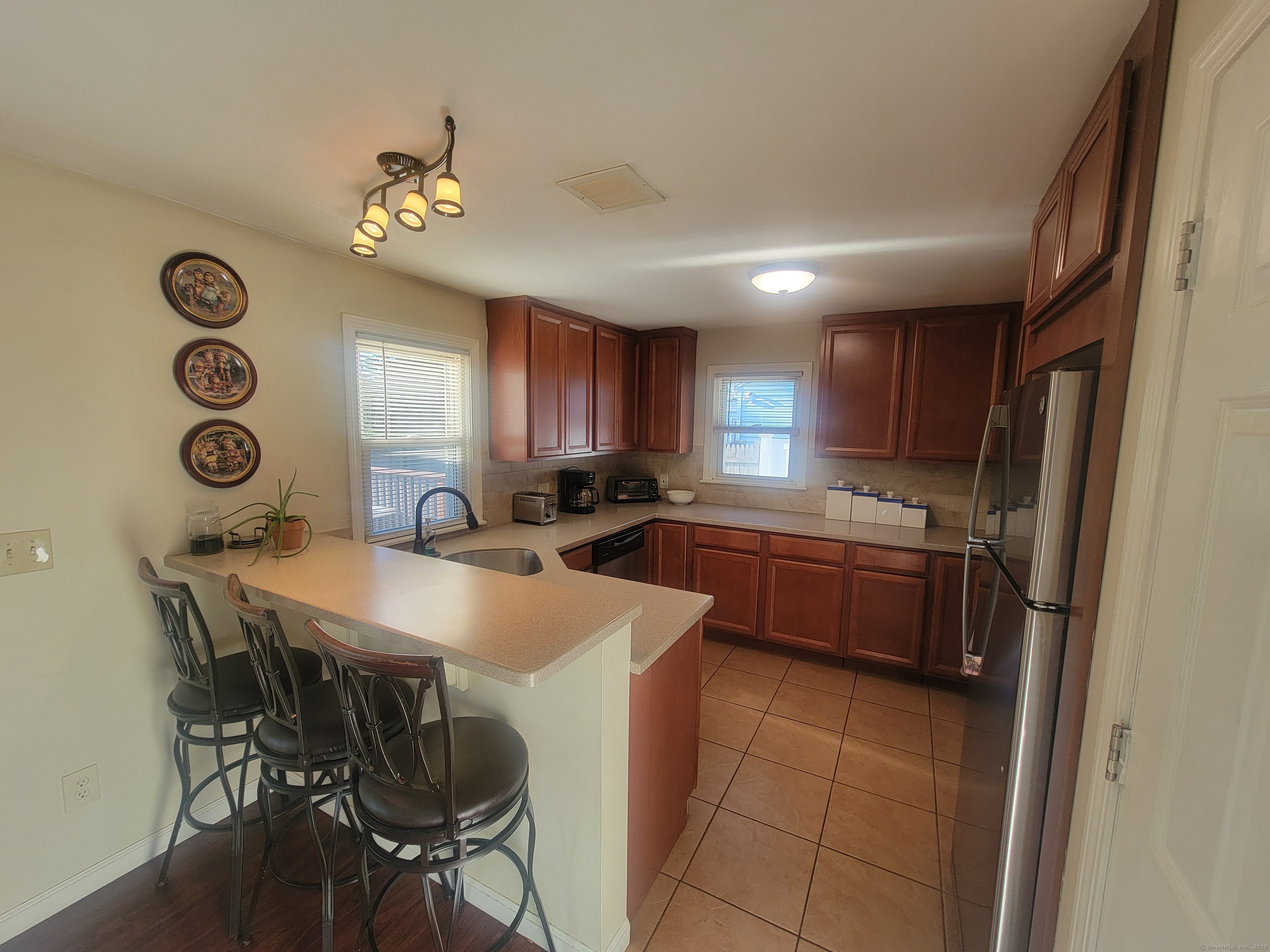 336 Circular Avenue Hamden, CT 06514 - Photo 10 of 21 a large kitchen with a table and chairs