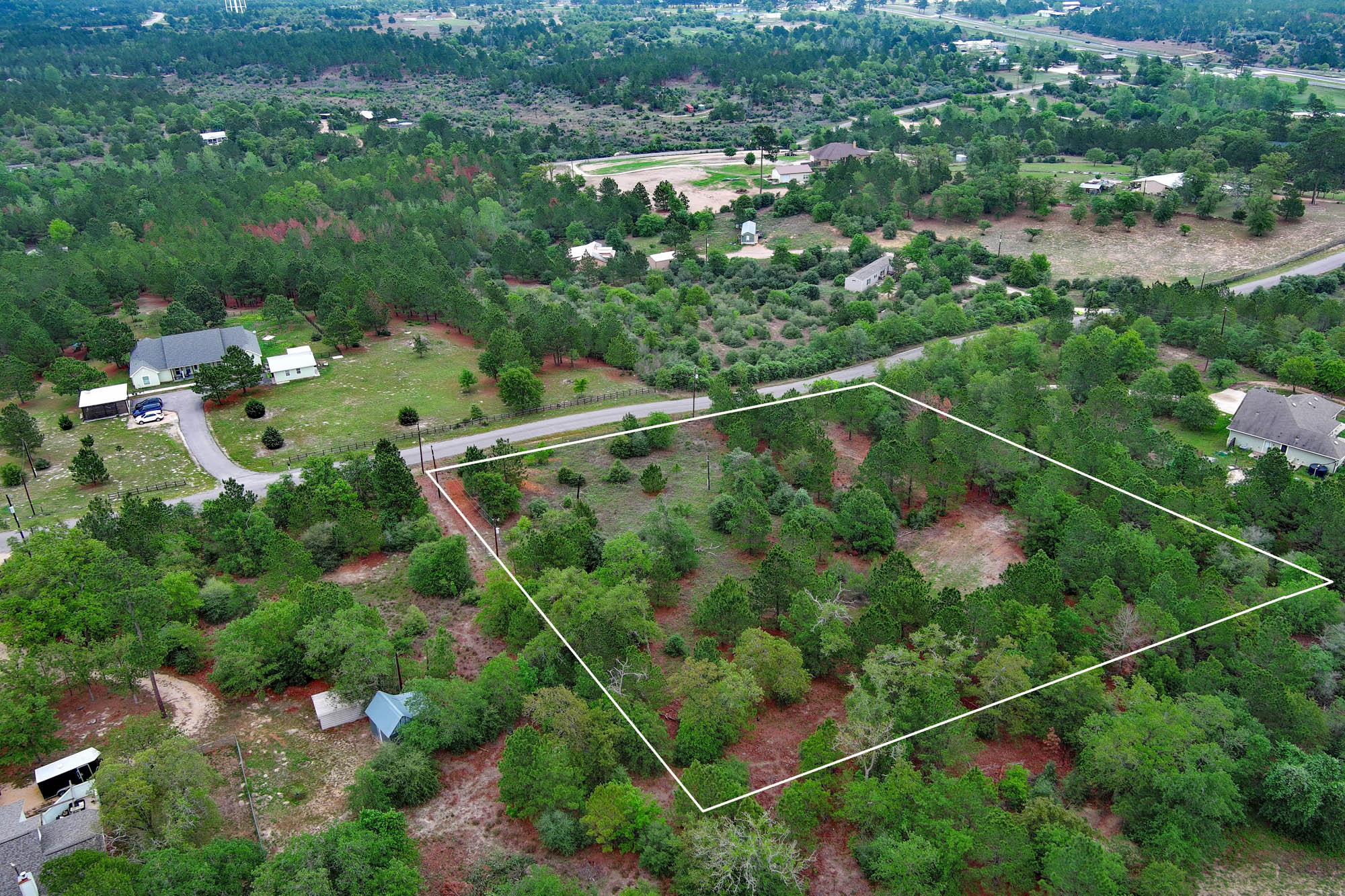 172 Kelley Road East Bastrop, TX 78602 - Photo 20 of 26 an aerial view of a house with a yard and lake view