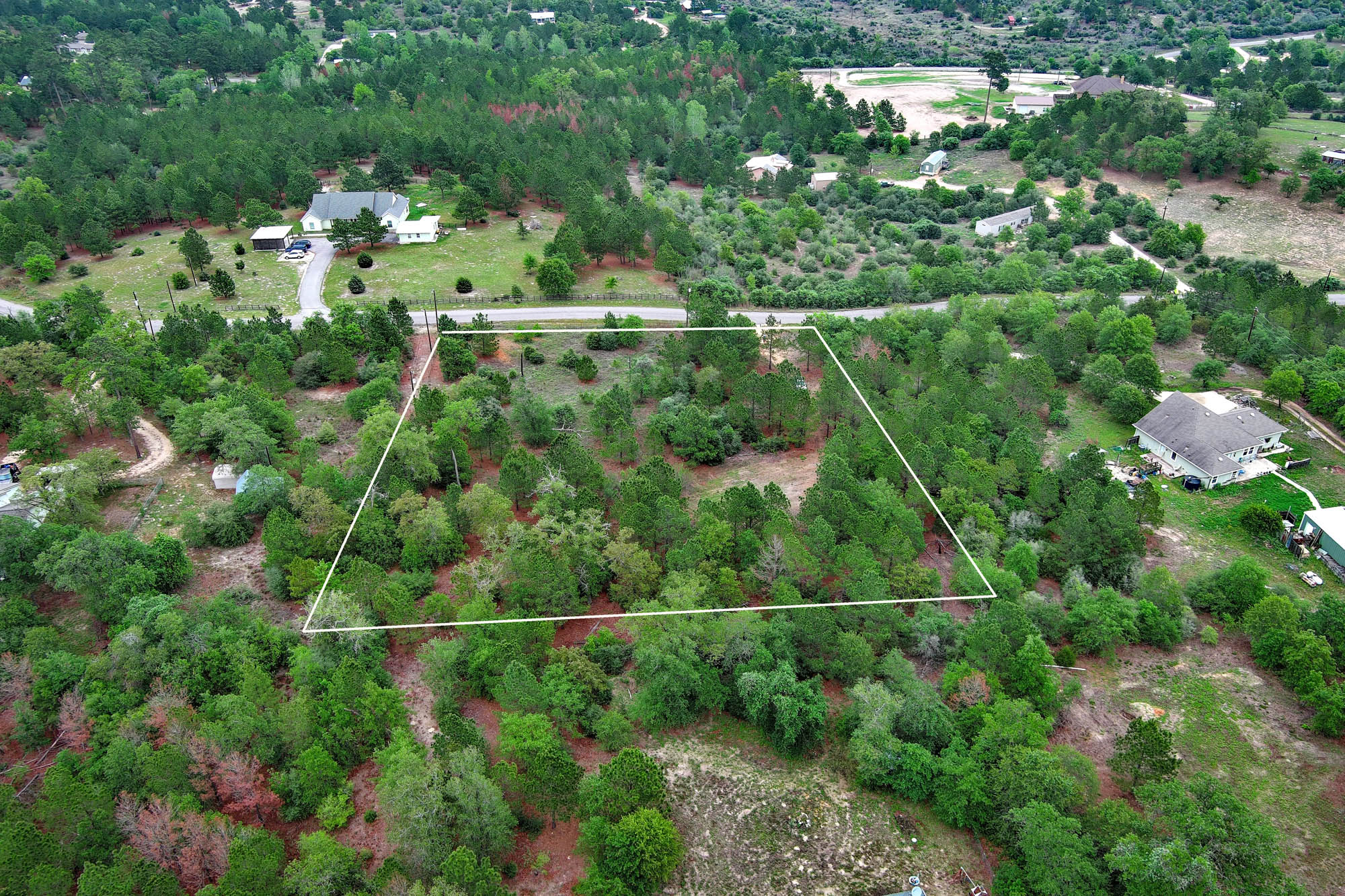 172 Kelley Road East Bastrop, TX 78602 - Photo 21 of 26 an aerial view of multiple house with yard