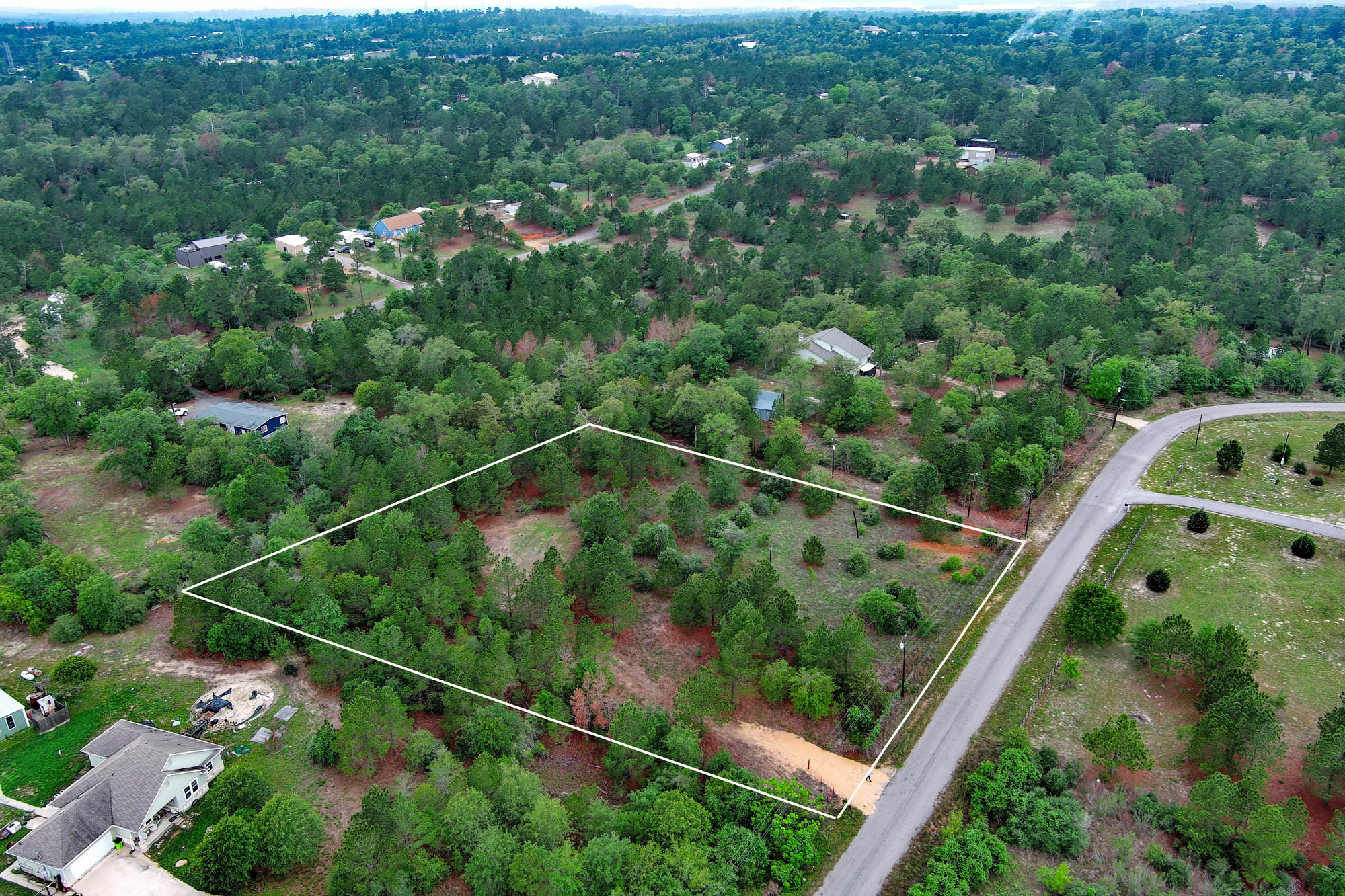 172 Kelley Road East Bastrop, TX 78602 - Photo 25 of 26 a view of a yard with a street view