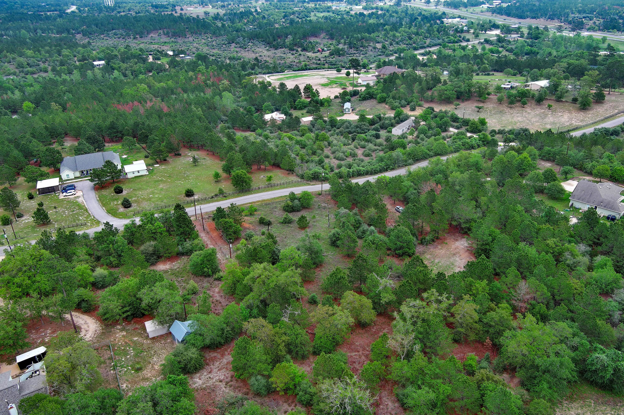 172 Kelley Road East Bastrop, TX 78602 - Photo 5 of 26 an aerial view of residential houses with outdoor space and trees